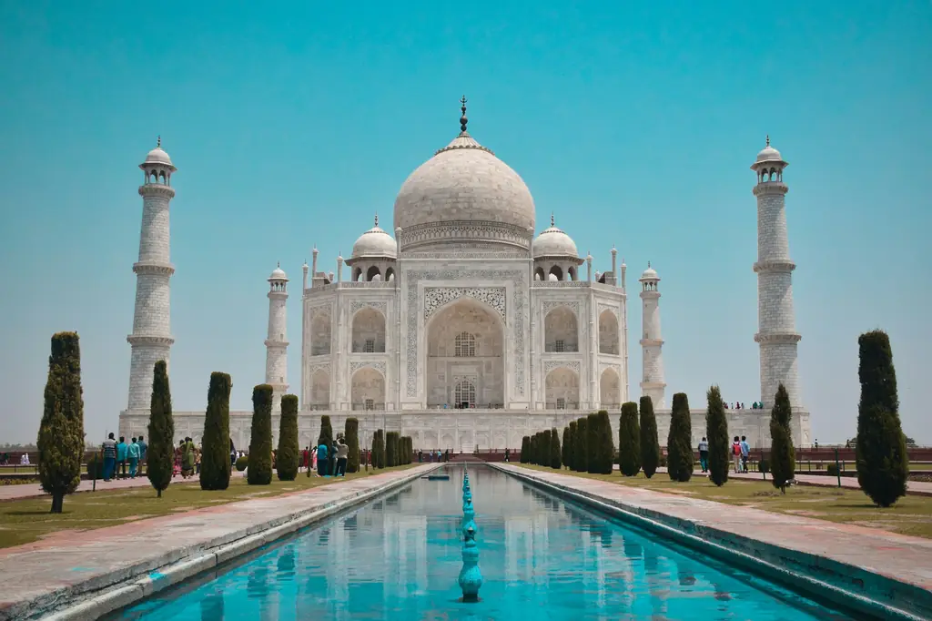 The Taj Mahal in Agra reflected in its long garden pool
