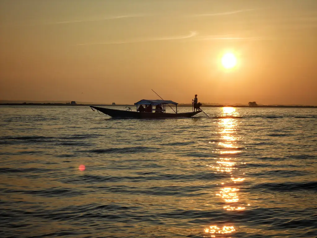Fishing boat on Chilika Lake at sunset