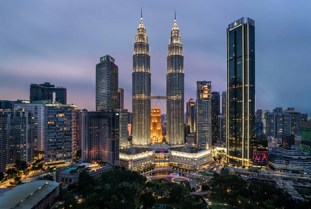 Petronas Twin Towers lit up over the Kuala Lumpur skyline