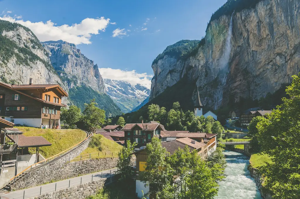 Lauterbrunnen valley with waterfall and chalets in Switzerland